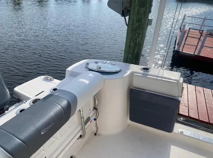  Yacht Photos Pics 2021 Robalo R272 Center Console boat interior by the water.