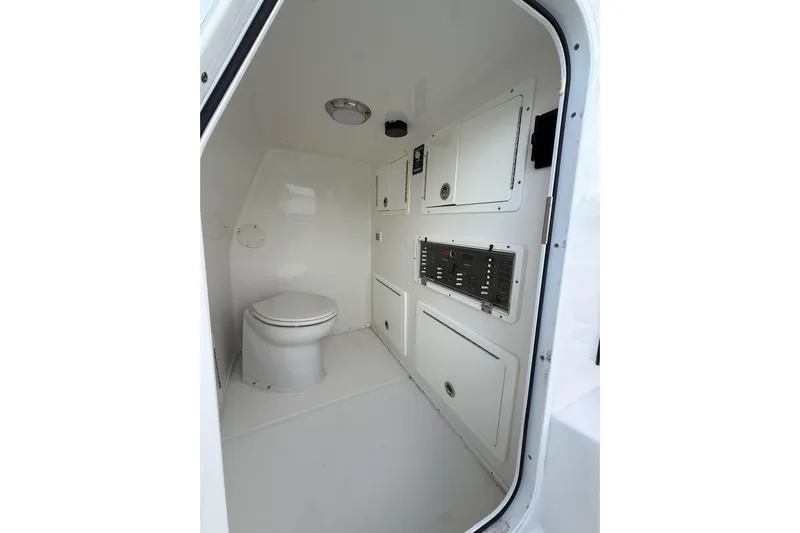  Yacht Photos Pics 2020 SeaHunter 41 CTS boat interior with toilet and control panels.