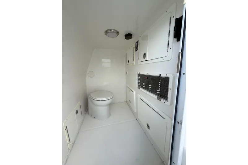  Yacht Photos Pics 2020 SeaHunter 41 CTS boat interior with toilet and storage compartments.
