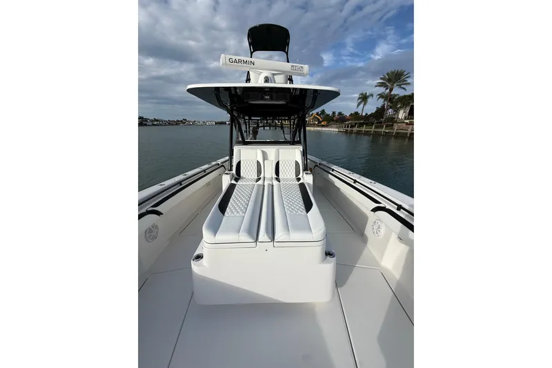  Yacht Photos Pics 2020 SeaHunter 41 CTS boat with sleek seating and Garmin equipment on a calm waterway.