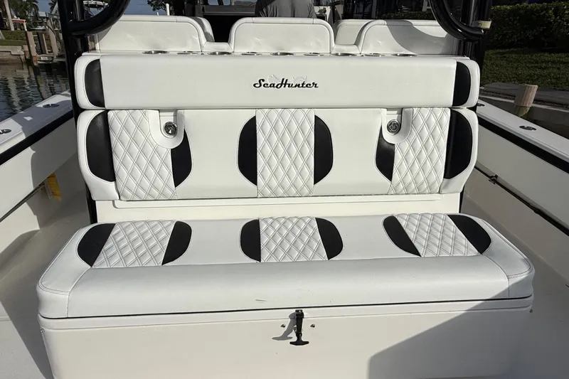  Yacht Photos Pics 2020 SeaHunter 41 CTS boat seating with white and black diamond-pattern upholstery.