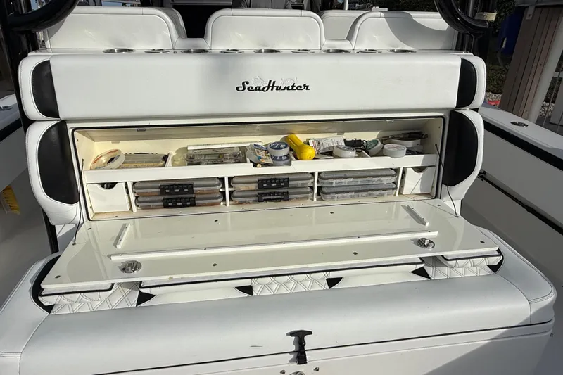  Yacht Photos Pics 2020 SeaHunter 41 CTS boat storage compartment with organized fishing gear and supplies.