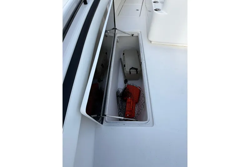  Yacht Photos Pics Storage compartment on 2020 SeaHunter 41 CTS boat, containing safety equipment and gear.