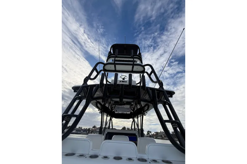  Yacht Photos Pics 2020 SeaHunter 41 CTS boat with tower against a cloudy sky backdrop.
