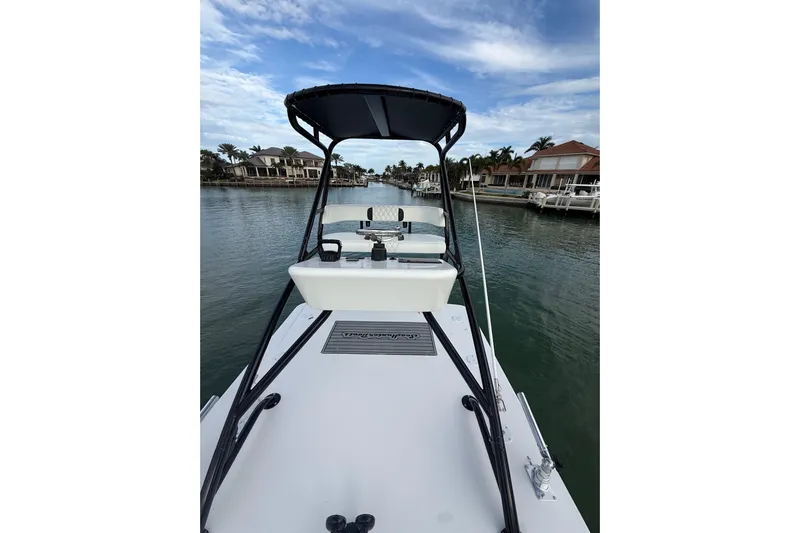  Yacht Photos Pics 2020 SeaHunter 41 CTS boat on a calm waterway, under a partly cloudy sky.