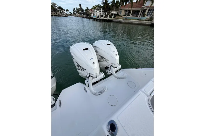 Yacht Photos Pics 2020 SeaHunter 41 CTS with twin Yamaha outboard engines on a calm waterway.