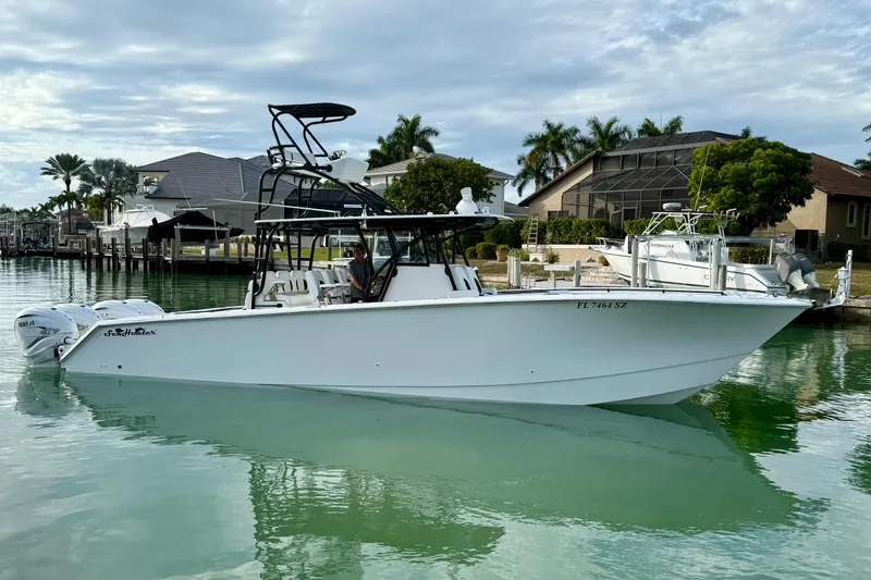  Yacht Photos Pics 2020 SeaHunter 41 CTS boat docked in a serene waterfront setting.