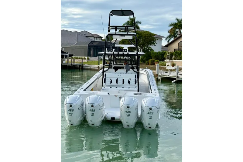  Yacht Photos Pics 2020 SeaHunter 41 CTS boat with four powerful 425 V8 engines docked in a serene marina.