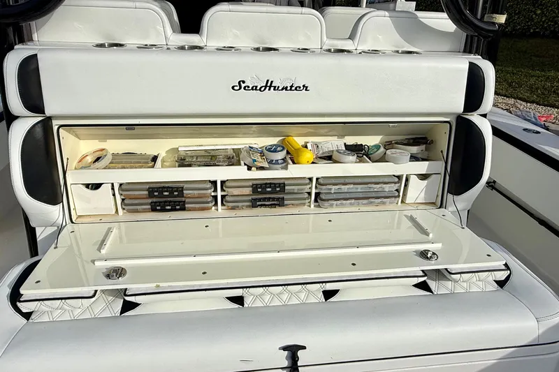  Yacht Photos Pics 2020 SeaHunter 41 CTS boat storage compartment with organized fishing gear and supplies.