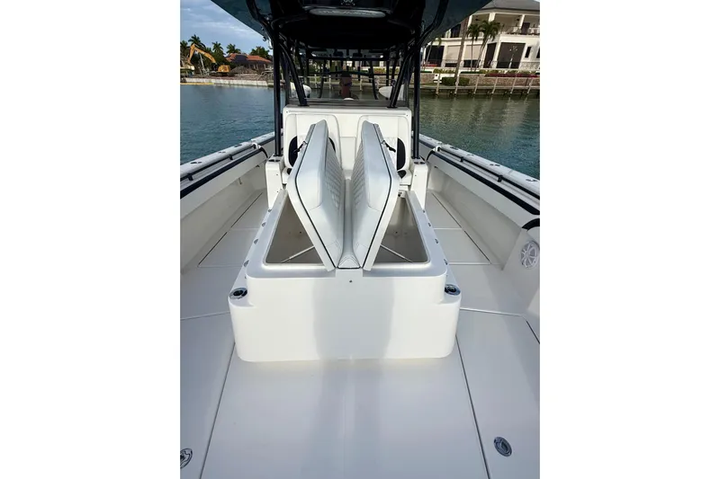  Yacht Photos Pics 2020 SeaHunter 41 CTS boat interior with open storage compartments, docked by waterfront homes.