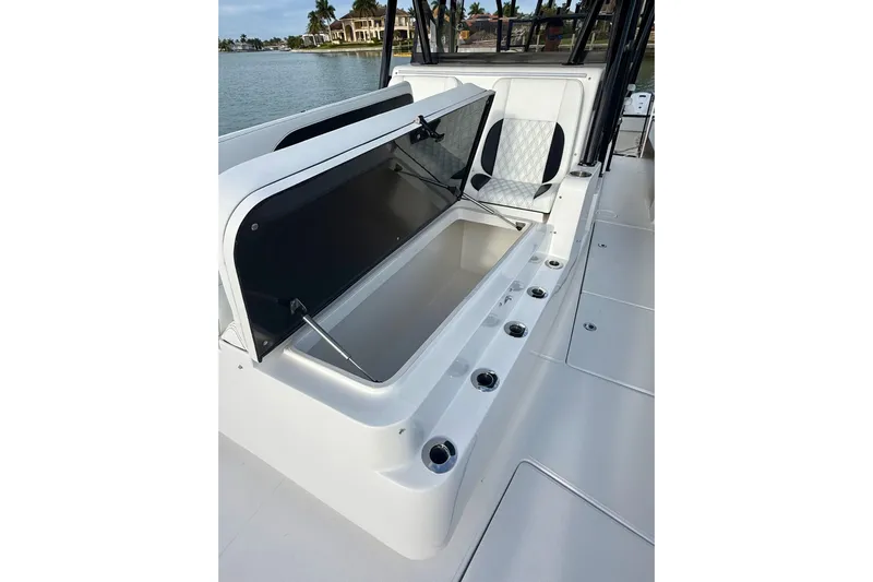  Yacht Photos Pics 2020 SeaHunter 41 CTS boat with open storage compartment, sleek design, and waterfront view.