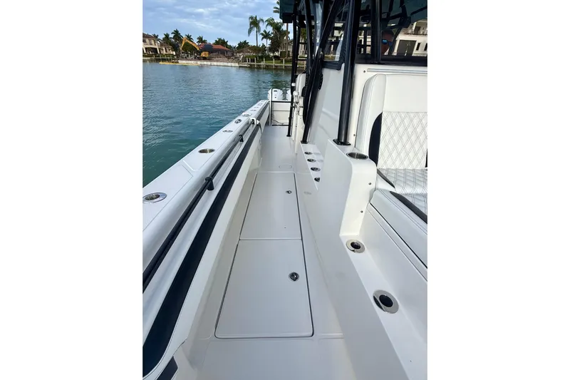  Yacht Photos Pics 2020 SeaHunter 41 CTS boat deck with seating, docked by waterfront homes.