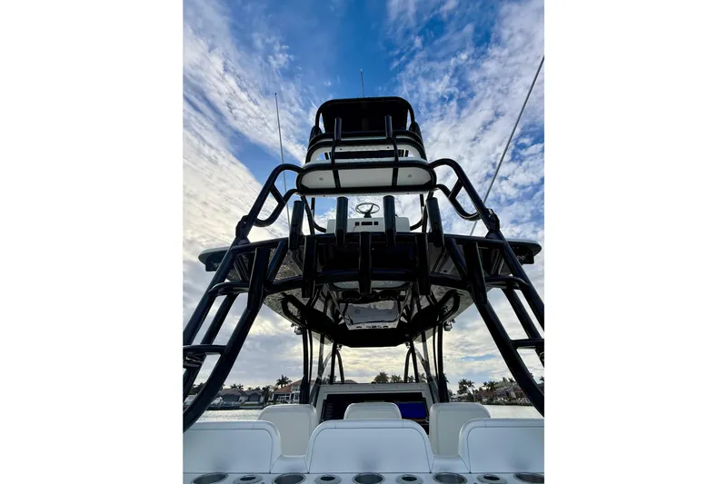  Yacht Photos Pics 2020 SeaHunter 41 CTS boat with tower against a cloudy sky backdrop.