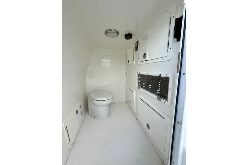  Yacht Photos Pics 2020 SeaHunter 41 CTS boat interior with toilet and storage compartments.