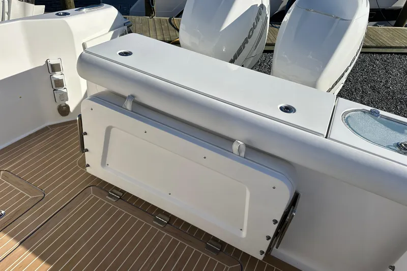  Yacht Photos Pics 2020 Southport 33DC boat deck with seating and twin Mercury engines.
