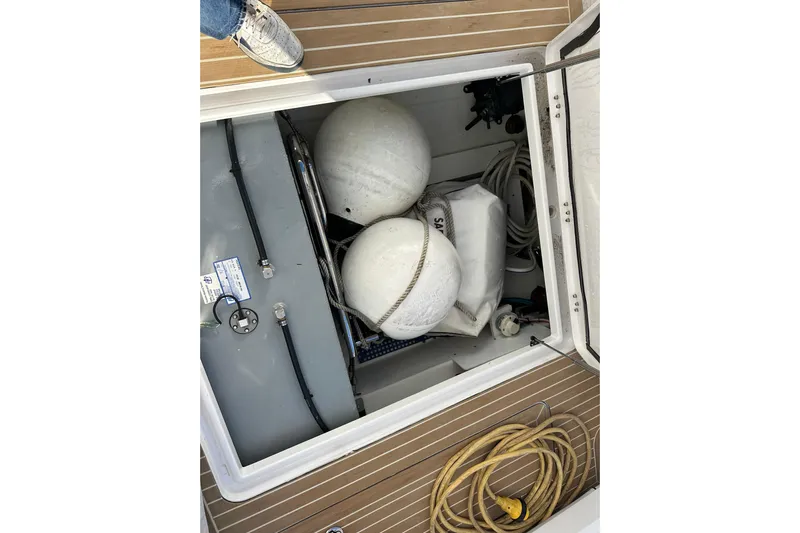  Yacht Photos Pics 2020 Southport 33DC boat storage compartment with fenders and ropes.