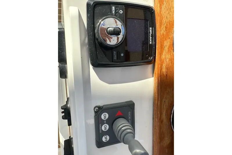  Yacht Photos Pics Control panel of a 2020 Southport 33DC boat featuring Zipwake and thruster controls.