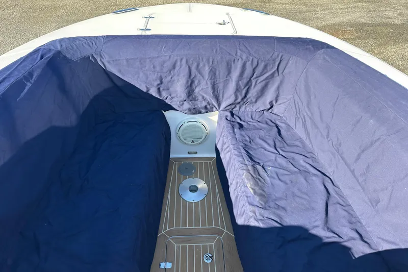  Yacht Photos Pics 2020 Southport 33DC boat interior with blue cover and wooden deck.