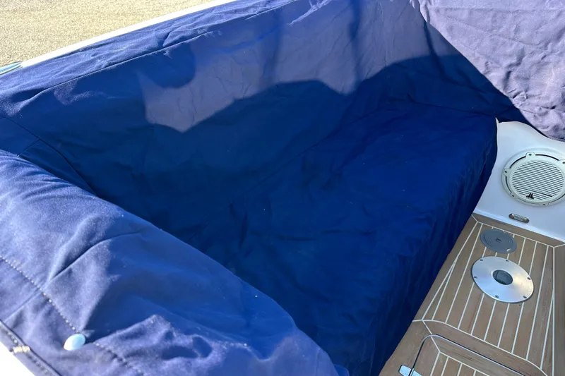 Yacht Photos Pics 2020 Southport 33DC boat interior with blue cover and wooden flooring.
