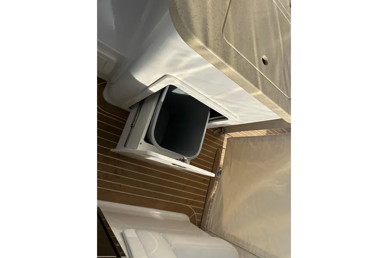  Yacht Photos Pics Interior of 2020 Southport 33DC boat showing open storage compartment and countertop.