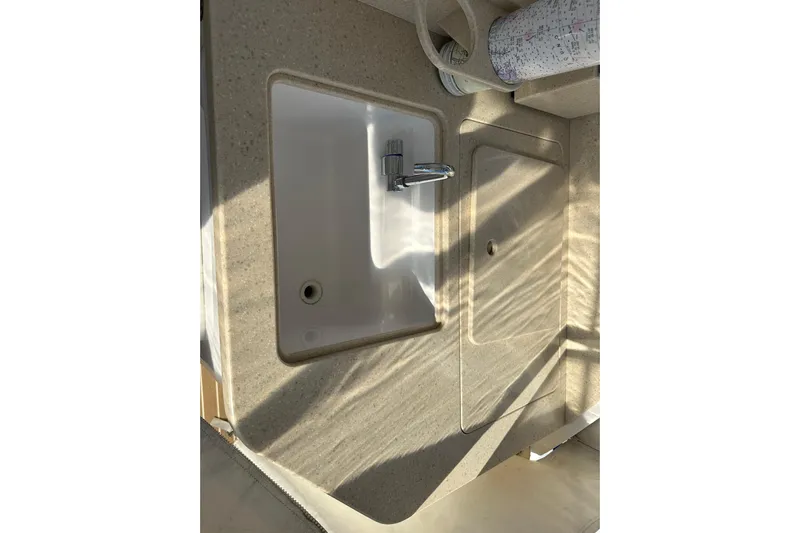  Yacht Photos Pics 2020 Southport 33DC boat sink and countertop with faucet in sunlight.