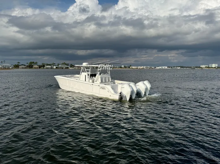  Yacht Photos Pics 2022 Invincible 35 Catamaran cruising on a cloudy day.