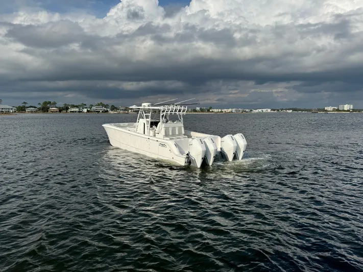  Yacht Photos Pics Invincible 35 Catamaran 2022 on water under cloudy sky.