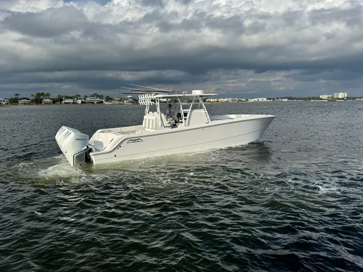  Yacht Photos Pics 2022 Invincible 35 Catamaran cruising on a cloudy day.