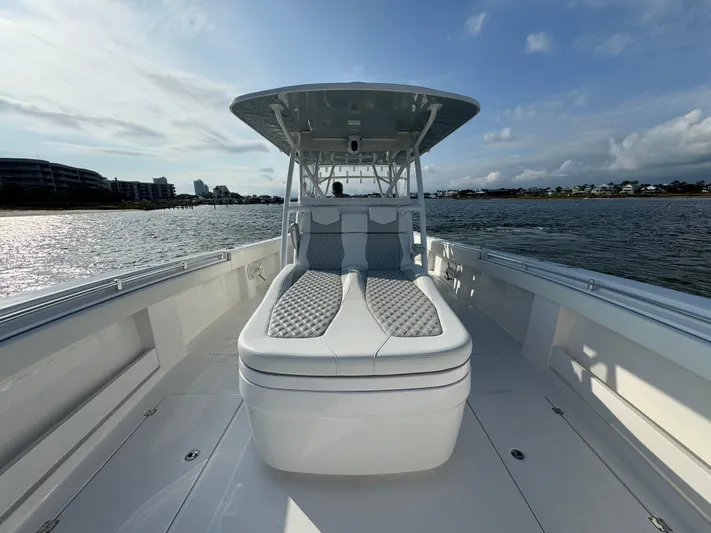  Yacht Photos Pics 2022 Invincible 35 Catamaran on water, featuring spacious deck and modern design.