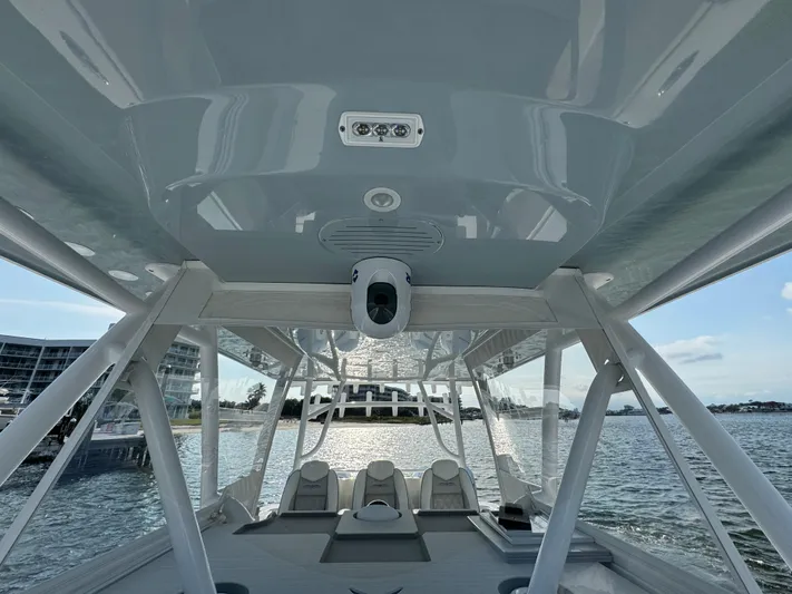 Yacht Photos Pics 2022 Invincible 35 Catamaran interior with seating, ocean view, and modern design.