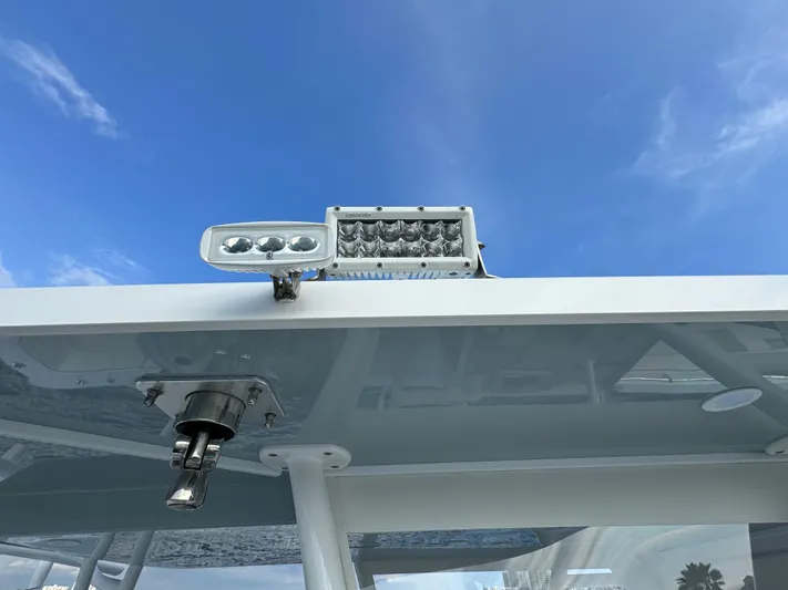  Yacht Photos Pics 2022 Invincible 35 Catamaran roof with mounted lights against blue sky.
