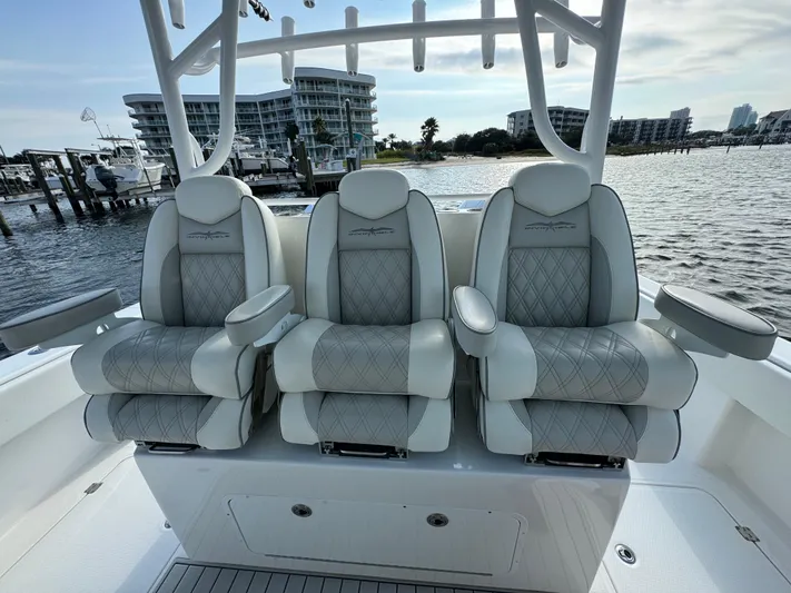  Yacht Photos Pics Luxury seating on 2022 Invincible 35 Catamaran, featuring elegant design and waterfront view.