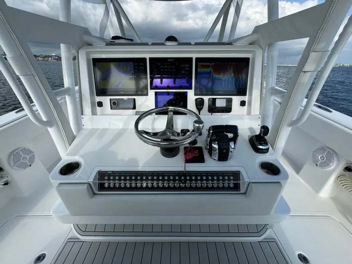  Yacht Photos Pics Invincible 35 Catamaran 2022 helm with advanced navigation displays and controls.