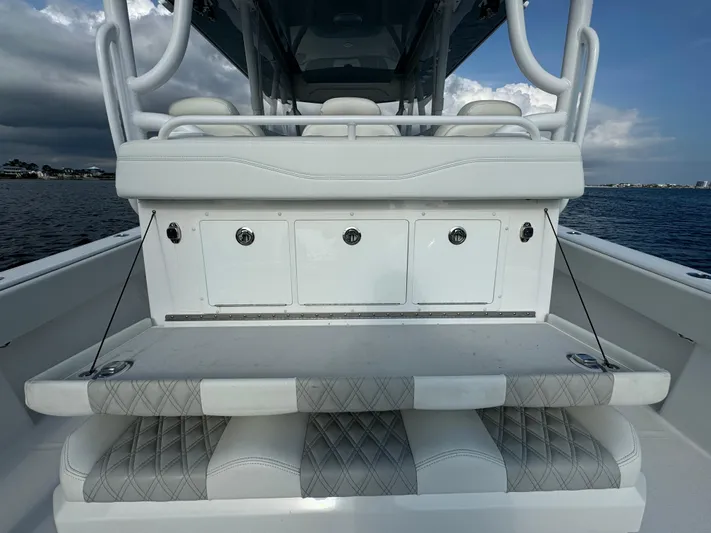  Yacht Photos Pics 2022 Invincible 35 Catamaran interior with white seating and storage compartments.