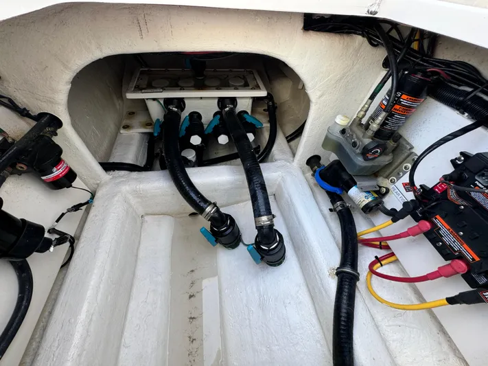 Yacht Photos Pics Engine compartment of 2022 Invincible 35 Catamaran with visible wiring and hoses.