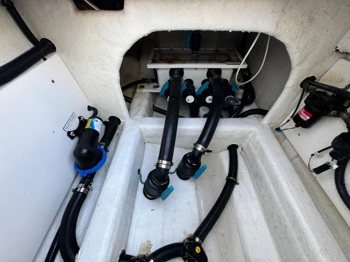  Yacht Photos Pics 2022 Invincible 35 Catamaran engine compartment with hoses and fittings.