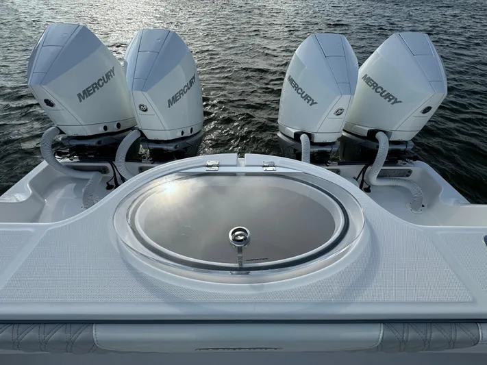  Yacht Photos Pics 2022 Invincible 35 Catamaran with triple Mercury engines on water.