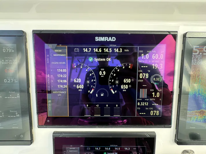  Yacht Photos Pics Simrad display on 2022 Invincible 35 Catamaran showing system status and navigation data.