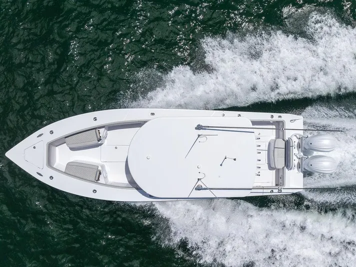  Yacht Photos Pics Aerial view of 2022 Jupiter 32 boat cruising on water with twin engines.
