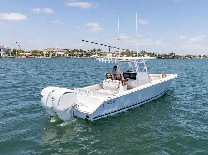  Yacht Photos Pics 2022 Jupiter 32 boat cruising on a sunny day with dual engines.