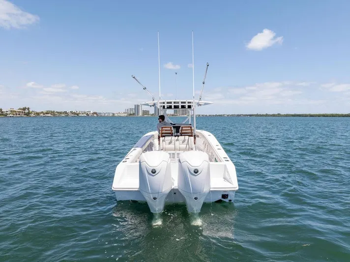  Yacht Photos Pics Jupiter 32 boat on open water, rear view, 2022 model, clear sky.