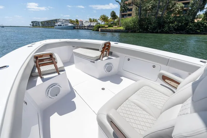  Yacht Photos Pics Luxurious 2022 Jupiter 32 boat interior with plush seating and scenic waterfront view.