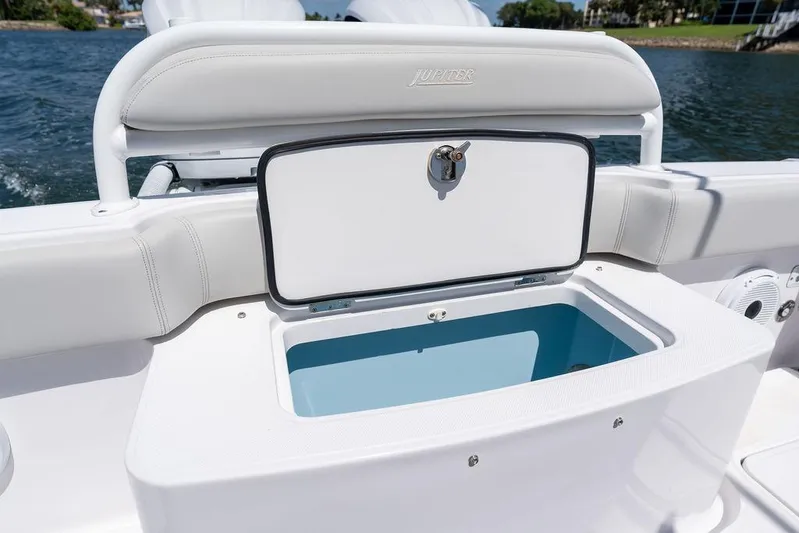  Yacht Photos Pics Open storage compartment on 2022 Jupiter 32 boat, near water.