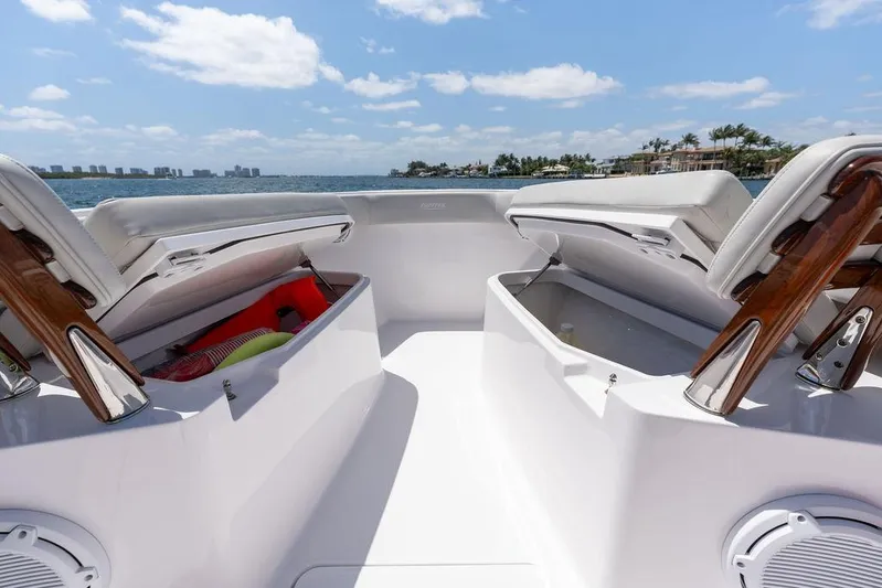  Yacht Photos Pics Jupiter 32 boat interior with open storage compartments, ocean view, sunny day, 2022 model.