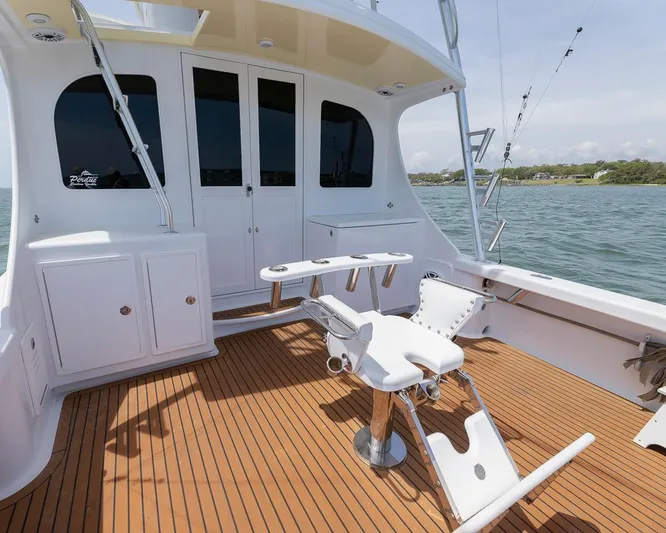 Yacht Photos Pics Luxurious 2013 Custom Express boat deck with teak flooring and fishing chair.