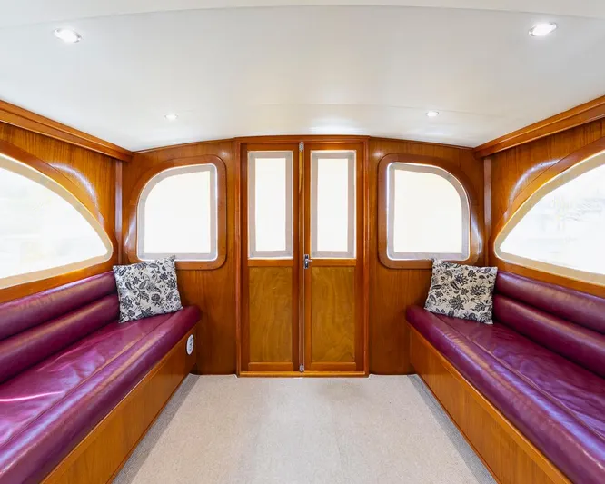  Yacht Photos Pics Luxurious 2013 Custom Express boat interior with wooden finish and plush seating.