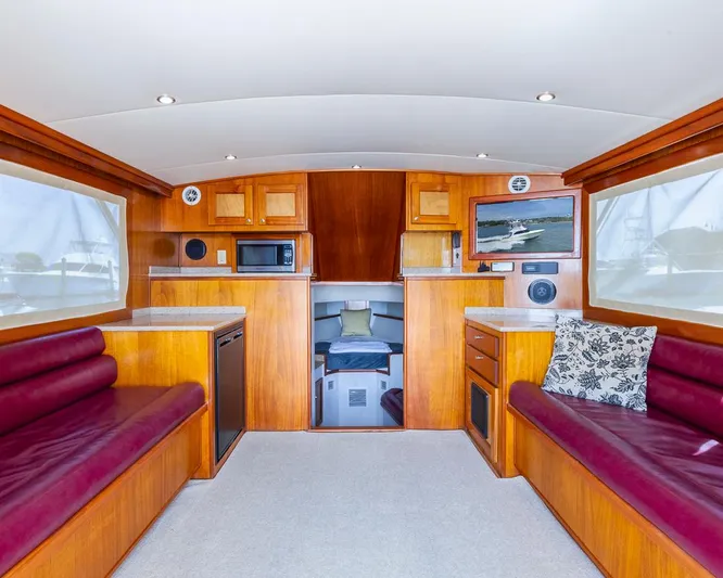 Yacht Photos Pics Luxurious 2013 Custom Express boat interior with wood finish, seating, and modern amenities.