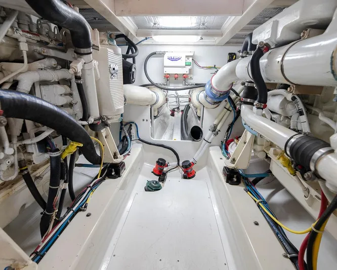  Yacht Photos Pics Engine room of a 2013 Custom Express boat, showcasing pipes and machinery.