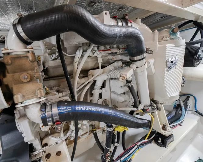  Yacht Photos Pics Engine compartment of a 2013 Custom Express, showcasing hoses and mechanical components.