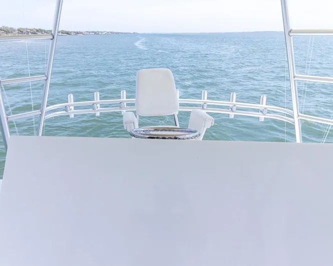  Yacht Photos Pics Custom Express 2013 boat helm overlooking calm ocean waters.